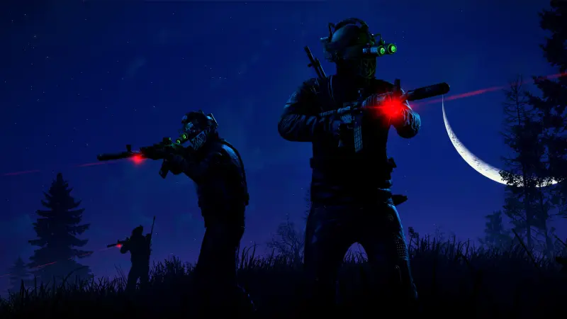 To Rust-spillere med nattsynsbriller sikter med laserrifler i mørket